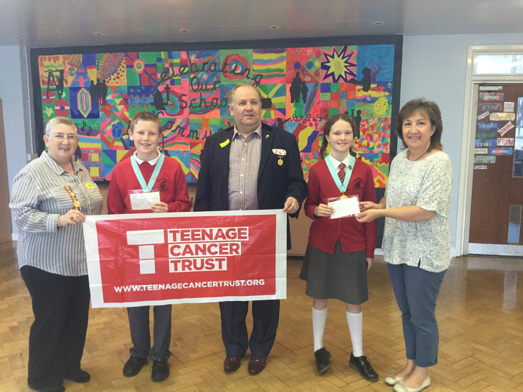 Handing over the cheques