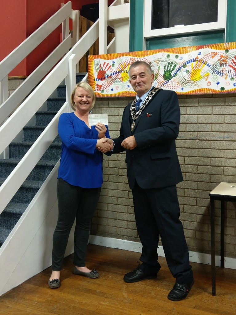 Photo of Mayor presenting cheque to FYA